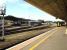 A defective 143617 heads out of Exeter TMD onto the up line to move across the depot site on 13 September, while 153305 waits at platform 6a to form the 16.25 to Plymouth. 143617 subsequently failed and blocked the up line for some 20 minutes, due to a brake release fault, and delayed 153305's departure before it could be got back onto the depot. <br><br>[David Pesterfield 13/09/2012]