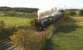 Ex-LMS Pacific no 46233 'Duchess of Sutherland' with the PMR Tours <I>Caledonian</I>, roars past Magiscroft near Cumbernauld on 6 October on its way to Stirling.<br><br>[Ken Browne 06/10/2012]