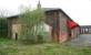 Part of the old goods yard at Ripon in April 2009, with several of the redundant buildings now put to use by private companies. View is south towards the exit on Hutton Bank, with the former station off picture to the right [see image 26739].<br><br>[John Furnevel 24/04/2009]