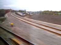 Open at last! A grab shot from a passing Turbostar, looking North along the Chord on 9 November. The yellow and red signals are normal aspects when one of the current two freight trains a day is not expected. The WCML can be seen on the right.<br><br>[Ken Strachan 09/11/2012]