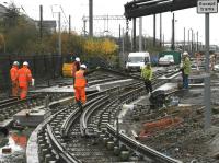 Installing a tram crossover at Haymarket Yards on 12 November. Looking west with the E & G main line running behind the shrubbery on the left. <br><br>[Bill Roberton 12/11/2012]