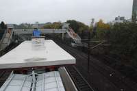 This view looks towards the footbridge and lifts under construction at the west (or north) end of Hyndland station. In the foreground is the top of a relatively recently added open air shelter. A new platform will be built to the right.<br><br>[Ewan Crawford 14/11/2012]
