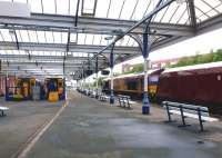 A coal train runs north through Kilmarnock station on 28 June 2012.<br><br>[Colin Miller 28/06/2012]
