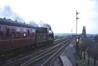 Ex-NBR 4-4-0 no 256 <I>Glen Douglas</I> about to cross the Forth Bridge northbound on 30 March 1964 with the SLS <I>'Scottish Rambler No 3'</I>. The special was heading for its next photostop at Dunfermline [see image 6929].<br><br>[Robin Barbour Collection (Courtesy Bruce McCartney) 30/03/1964]