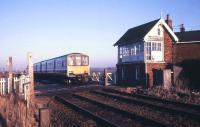 A DMU on the level crossing at East Ville, Lincolnshire, on the Skegness branch, on a cold January morning in 1987.  <br><br>[Ian Dinmore /01/1987]