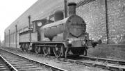 Barton Wright 2F 0-6-0 no 52044 (ex-LYR class 25 no 957) standing alongside 56A Wakefield shed in 1959, the year of its withdrawal by BR. Built by Beyer Peacock in 1887 the locomotive is now preserved on the KWVR. No 957's main claim to fame was appearing as 'The Green Dragon' in the 1970 film <I>The Railway Children</I>.<br><br>[K A Gray //1959]