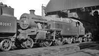 Shed scene at Bangor (6H), thought to have been photographed in 1959, featuring 2-6-4 tanks. Stanier no 42567 is stabled behind BR Standard example no 80087.<br><br>[K A Gray //1959]