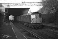 A short fitted freight hauled by BRCW Type 2 No. D5310 emerges from under the Union Canal and Colinton Road in March 1970 to pass between the disused platforms of Craiglockhart station. The train is thought to be the early running 13.15 Perth to Millerhill. <br><br>[Bill Jamieson 13/03/1970]