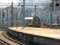 A CR diesel locomotive runs round its train at the south end of Hangzhou station on 13 December.<br><br>[Mark Poustie 13/12/2012]