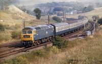Passing the west end of the Grantshouse loops, Brush Type 4 No. 1534 has just over 40 miles to go before reaching journey's end with the 10.45 Kings Cross to Edinburgh service in August 1971.<br><br>[Bill Jamieson 19/08/1971]