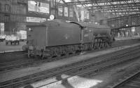 An undated photograph showing Gresley A3 Pacific no 60079 <I>Bayardo</I> posing alongside platform 4 at Carlisle station. One of the small band of 'Canal Pacifics' used on Waverley route services, no 60079 spent the whole of the period from nationalisation up to withdrawal in September 1961 at Carlisle Canal shed. [See image 19295]<br><br>[K A Gray //]