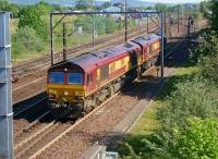 A pair of Class 66s come out of the down loop at Beattock and resume their journey north on 27 May 2012.<br><br>[John McIntyre 27/05/2012]