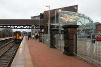 Until recently St Helens Central, or Shaw St as it was previously known, had some bland 1970s station buildings. The new station however is very impressive and makes full use of the glass the town is famous for. 156424 draws to a halt with a late afternoon service from Lime St to Blackpool. This line is due to be electrified by December 2014.<br><br>[Mark Bartlett 28/12/2012]