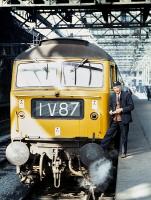 The timetable changes in the spring of 1971 included the commencement of through working to the Western Region, specifically the 09.40 Edinburgh - Paignton, which made the 1V reporting number an everyday sight in the Scottish capital. Driver Robinson of Gateshead stands next to the first southbound train, hauled by Brush Type 4 No. 1538 of Immimgham, shortly before departure from Waverley on 3rd May 1971.<br><br>[Bill Jamieson 03/05/1971]