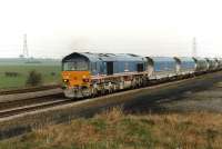 National Power's 59205 approaching Burton Salmon with a coal train from the Selby coalfield Gascoigne Wood loading point to Drax Power Station in March 1997. The front two wagons appear to be recently into service. <br><br>[David Pesterfield 07/03/1997]