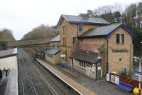 The 1847 station building at Broadbottom is in near original external condition, despite a pub having been incorporated into part of the building. The station, and nearby Broadbottom viaduct, are listed on the Transport Heritage Trust website as being of special interest. There is a half hourly service in each direction on the Manchester - Glossop/Hadfield route. This view is towards Manchester from the station footbridge. <br><br>[Mark Bartlett 28/12/2012]