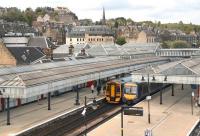 View north west over Stirling station in May 2012 from the pedestrian footbridge. Trains for Dunblane and Glasgow Queen Street are at the platforms and Stirling Castle overlooks the scene top left.<br><br>[John Furnevel 09/05/2012]