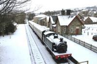 A thin layer of snow at Hawes station but a scene otherwise unchanged for many years. View towards Aysgarth from the road overbridge in January 2013. There is clearly not much heat being generated from the boiler of the <I>G5 lookalike</I> tank engine which has been on static display here for a long time now.<br><br>[Mark Bartlett 20/01/2013]