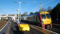 The new footbridge at Hyndland station is now in use and the old one removed. A Helensburgh - Edinburgh service pauses in February 2013.<br><br>[Ewan Crawford 02/02/2013]