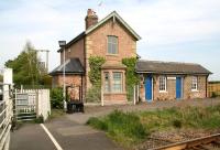The old station at Hessay on the Harrogate - York line in April 2009. The building is now a private house, although the annexe on the left provides accommodation for the signalman / crossing keeper, whose levers and instruments are located on the platform.<br><br>[John Furnevel 24/04/2009]