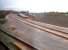 Open at last! A grab shot from a passing Turbostar, looking North along the Chord on 9 November. The yellow and red signals are normal aspects when one of the current two freight trains a day is not expected. The WCML can be seen on the right.<br><br>[Ken Strachan 09/11/2012]