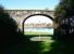 Looking north through the central arch of Dock Road Viaduct, Tweedmouth, on 7 October 2012 [see image 40843]. The River Tweed runs across the centre of the picture beyond Dock Road itself, with a section of the town walls of Berwick prominent on the north side of the estuary.<br><br>[John Furnevel 07/10/2012]