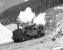 Having taken the 11.20 half load of iron ore from Erzberg to the summit station at Prbichl, conventional chimneyed 0-6-2RT No. 97.207 and Giesl fitted No. 97203 drift downhill at Feistawiese on 15 April 1976 on their way to pick up the second portion. <br><br>[Bill Jamieson 15/04/1976]