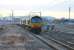 After a night when nearby Shap was the coldest place in the UK (at -7C), a late running <I>Stobart Tesco Express</I> is diverted into the Down loop at a very frosty Penrith to allow two passenger services to overtake. DRS 66421 and 66423 were in charge of the train, the rear of which can be seen above the siding buffers to the right of 66421. <br><br>[Mark Bartlett 30/11/2012]