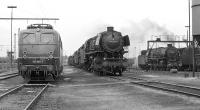 A varied selection of motive power in the shed yard at Rheine in September 1974. On the left is type E40 electric No. 140 846 which was only two years old at the time. To its right stands heavy freight coal-fired 2-10-0 No. 044 534, which was a regular visitor from Emden depot, while on the far right is 3 cylinder oil-fired Pacific No. 012 066, which survives today in working order.<br><br>[Bill Jamieson 07/09/1974]