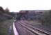 Platform view north at Neath Riverside station in May 1988, approximately 24 years after closure to passengers. The signal box is Neath and Brecon Junction and the passing HST is on the South Wales main line.<br><br>[Ian Dinmore /05/1988]