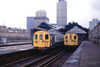 Two North London Line trains stand at Broad Street in 1986, the year the station finally closed. The site subsequently became home to the Broadgate Centre, at that time London's largest office development.<br><br>[Ian Dinmore //1986]
