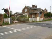 The old station at Flaxton, North Yorkshire, closed to passengers in September 1930. View north over the level crossing in April 2009. <br><br>[John Furnevel 19/04/2009]
