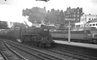 Polmadie's Standard class 5 4-6-0 no 73059 arrives at Carlisle from the north on 30 July 1966 with an unidentified working. Brush Type 4 no D1976 (delivered new to Haymarket the previous November) is standing in the bay. <br><br>[K A Gray 30/07/1966]