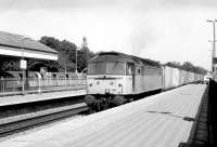 47188 accelerates west through Ealing Broadway platform 3 in 1981 after bringing a trainload of containers off the North London Line at Acton Wells Junction. A Central Line train is awaiting its departure time at platform 6. <br><br>[John Furnevel 29/04/1981]