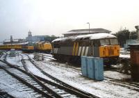 Scene on the east side of a snow covered Derby Station on 11 February 2013. Nearest the camera is 56301, while in the background 97304 on a Network Rail test train stands alongside 31190.<br><br>[David Pesterfield 11/02/2013]