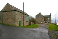 The former station at Wark, Northumberland, in November 2007. The line ran along the other side of the buildings and the view is south towards Hexham. Wark station closed to passengers in October 1956. [See image 17385]<br><br>[John Furnevel 05/11/2007]