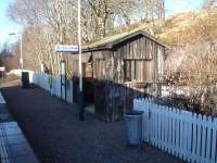 Beasdale Station's rustic waiting shelter located on the up side platform caught on camera during a station call at this request stop on 20 February.<br><br>[David Pesterfield 20/02/2013]