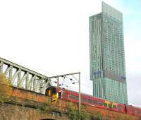 An East Midlands Train passing over Castlefield Viaduct (Ordsall Lane) Manchester in September 2009 under the shadow of the 47-storey Beetham Tower.<br><br>[Ian Dinmore /09/2009]