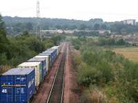 Containers bound for Aberdeen leave Grangemouth in September 2006. The train will join the main line at Grangemouth Junction, just east of Falkirk Grahamston station. [See image 35008]<br><br>[John Furnevel 21/09/2006]