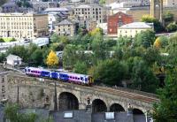 A Manchester Victoria service entering Halifax station from Beacon hill viaduct in September 2009.<br><br>[Ian Dinmore /09/2009]