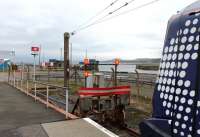 The buffers at Ardrossan Harbour, and a Class 380 newly arrived from Glasgow. Prior to 1987 when this station opened the line continued a short distance to the station at Ardrossan Winton Pier.<br><br>[Mark Bartlett 08/03/2013]