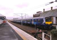 A six car EMU combination stands at the buffers in Lanark station having just arrived from Milngavie on 8 March. Scotrail blue 320314 led the train in with carmine and cream 318252 on the rear. <br><br>[Mark Bartlett 08/03/2013]