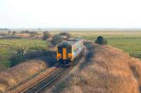 A DMU crossing Halvergate Fens near Acle between Great Yarmouth and Norwich in 2006.<br><br>[Ian Dinmore //2006]