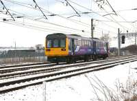 A Northern Class 142 heads south at Farington Junction on a Blackpool to Manchester Victoria service on a cold 23 March 2013.  On the left is the Leyland Trucks factory.<br><br>[John McIntyre 23/03/2013]