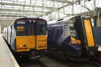 Scotrail's oldest and newest EMU's side by side at Glasgow Central in March 2013, with 314208 on a Paisley Canal service and 380019 bound for Gourock. The Class 380 was introduced in 2010, and was preceded 31 years earlier by the Class 314, with the latter being retained in service until at least 2015.<br><br>[Graham Morgan 12/03/2013]