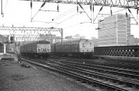 Class 303 unit no 042 departs from Glasgow Central with a Cathcart Outer circle service on 22 March 1974 as a Metro-Cammell DMU heads for Lanark.<br><br>[John McIntyre 22/03/1974]