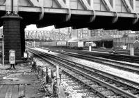 Looking across LT and BR lines from Royal Oak Hammersmith & City Line station towards Paddington parcels depot in September 1979. A class 31 is manoeuvering vans while another stands at the parcels platform. Part of the main line station can be seen in the left background. Paddington parcels depot closed during the 1980s. [See image 36915] <br><br>[John Furnevel 14/09/1979]