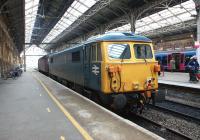 The last mainline registered Class 87 being towed south for probably the last time on 11 April 2013. 87002, which had been performing ice-breaking duties based at Carlisle during the past few months, was photographed being hauled south through Preston station by 47245. [See image 16478] <br><br>[John McIntyre 11/04/2013]