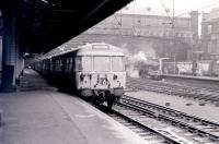 An EMU for Neilston leaves Glasgow Central on 27 March 1967. In the background 'Jubilee' no 45647 <I>Sturdee</I> awaits its departure time with the 10.05 to Leeds. [See image 21911]. <br><br>[Colin Miller 27/03/1967]