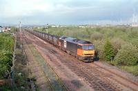 A coal train approaching Fouldubs Junction from Grangemouth docks in 1997 behind Loadhaul liveried 60025. <br><br>[Ewan Crawford //1997]